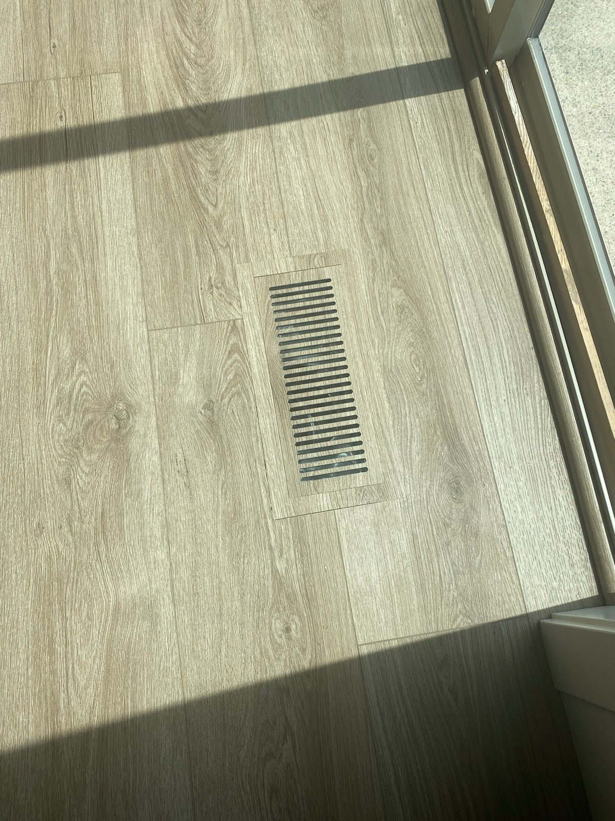 Modern, flush-mount LVP floor vent that enhances the beauty of your space while providing consistent airflow throughout the room