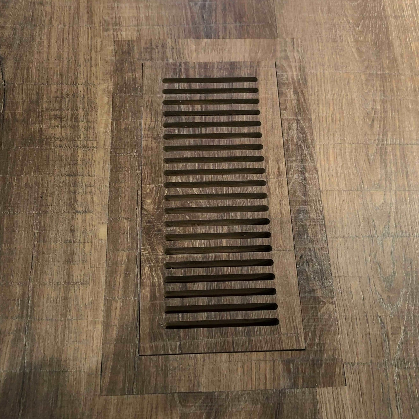 Durable and functional LVP floor vent designed to maintain airflow efficiency while blending perfectly with luxury vinyl plank floors.