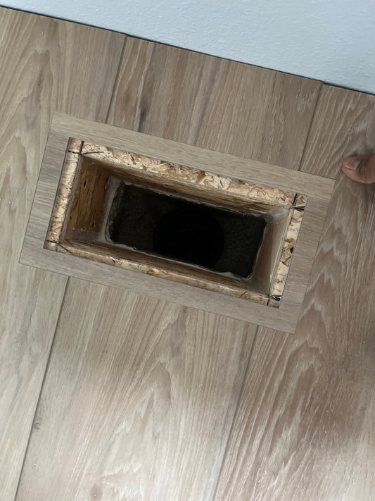 How do I remove a floor vent cover?