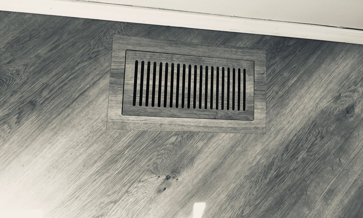 Vents.com flush vent in a gray wood-look floor