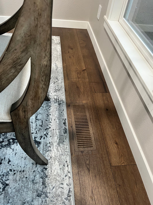 Custom LVP floor vent designed to blend seamlessly with luxury vinyl plank flooring, offering optimal airflow and a polished finish.